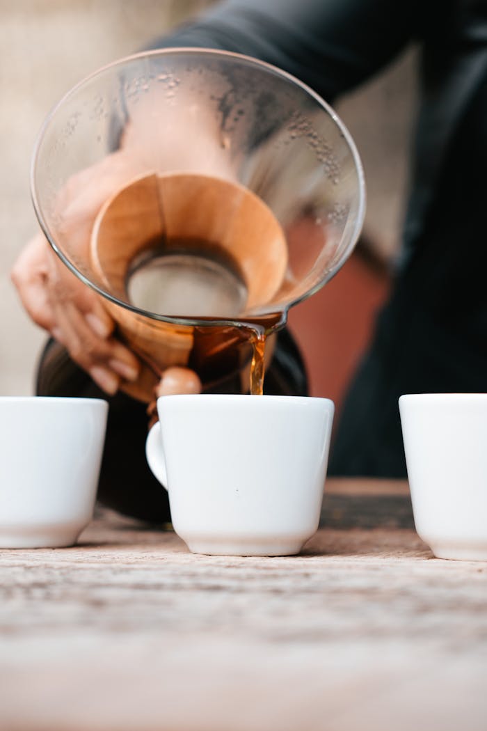 Close-up of coffee being poured into cups in Xicotepec de Juárez, Puebla.